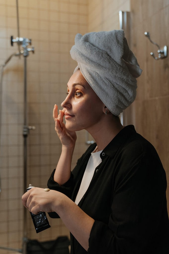 Woman Learning How To Apply Moisturizer On Face